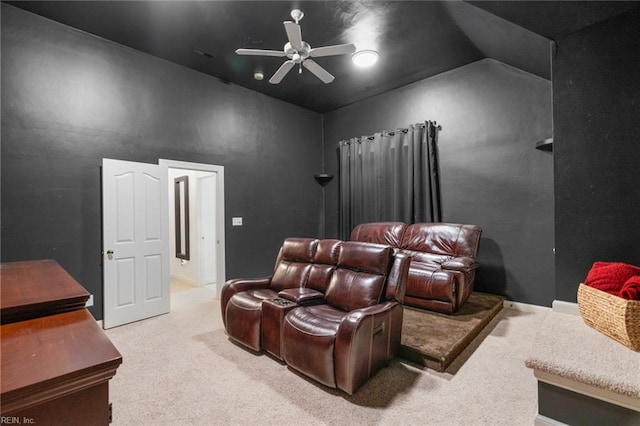 home theater room featuring carpet flooring, ceiling fan, and vaulted ceiling