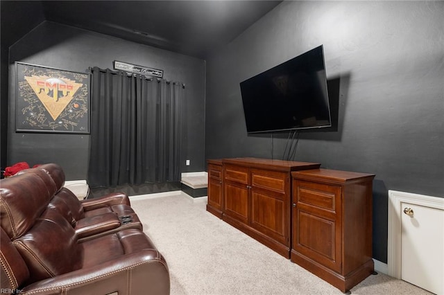 cinema with baseboards and carpet flooring