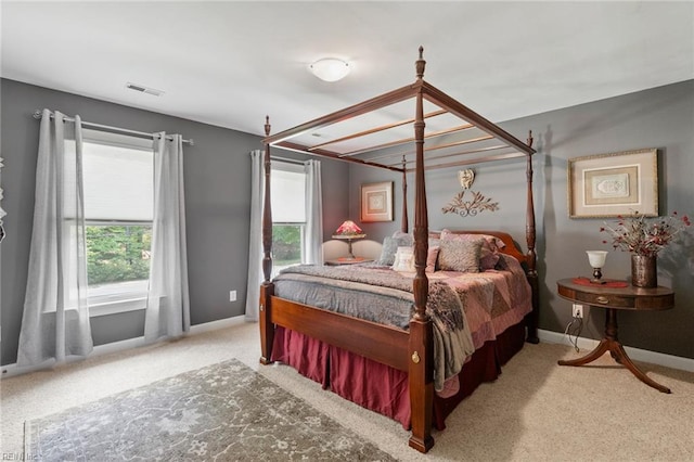 bedroom featuring carpet floors, baseboards, and visible vents