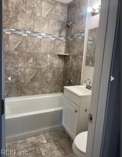 full bath featuring toilet, vanity, and  shower combination