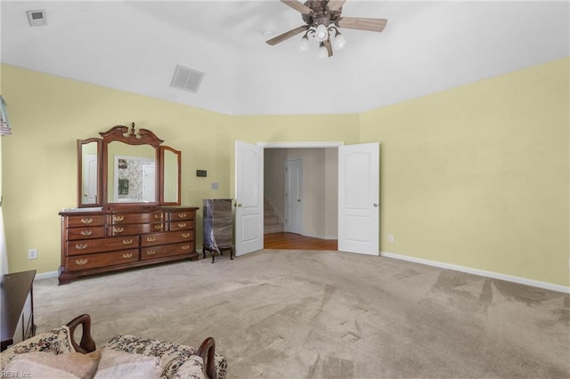 carpeted bedroom featuring visible vents, a ceiling fan, vaulted ceiling, and baseboards