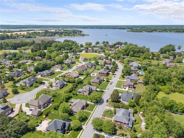 bird's eye view featuring a water view and a residential view
