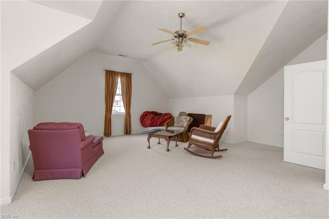 sitting room featuring a ceiling fan, carpet flooring, vaulted ceiling, and baseboards