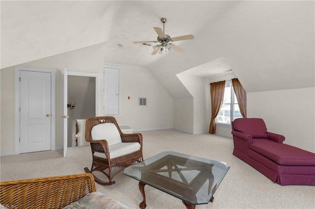 carpeted living area featuring baseboards, visible vents, ceiling fan, and lofted ceiling