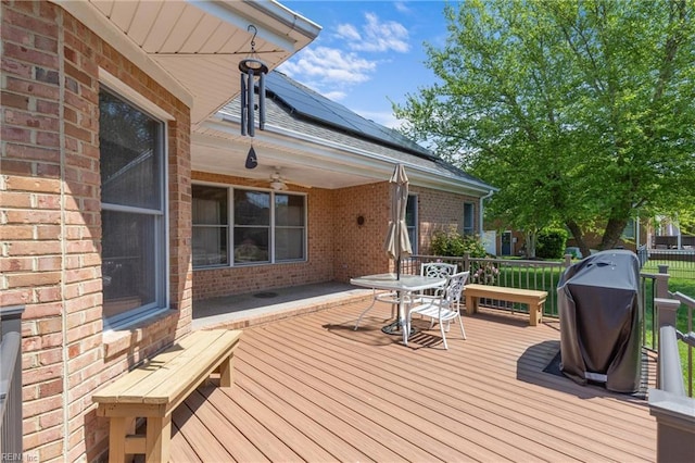 deck with outdoor dining area