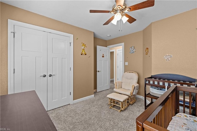 bedroom featuring a closet, carpet flooring, a ceiling fan, and baseboards