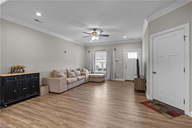 living area with recessed lighting, light wood-style floors, visible vents, a ceiling fan, and crown molding