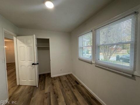 407 Wilson Ct, Suffolk, VA 23434 - unfurnished bedroom featuring wood finished floors, a closet, and baseboards