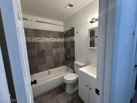 407 Wilson Ct, Suffolk, VA 23434 - bathroom featuring vanity, shower / bath combination, toilet, visible vents, and tile patterned flooring