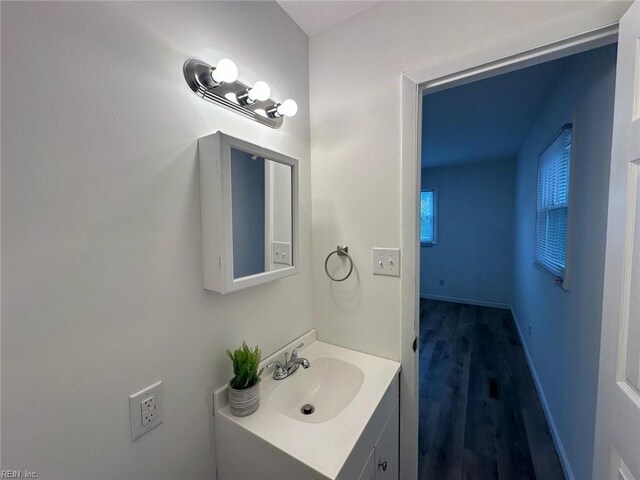 407 Wilson Ct, Suffolk, VA 23434 - bathroom with baseboards, wood finished floors, and vanity