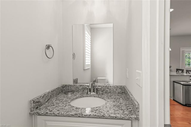 bathroom featuring toilet and vanity
