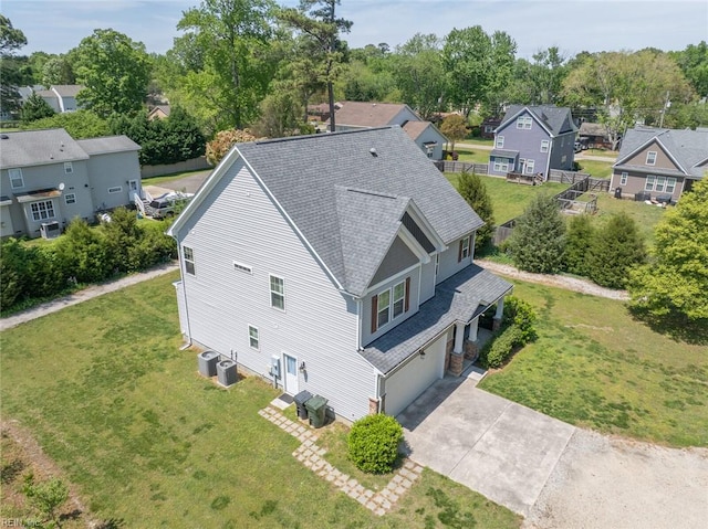birds eye view of property with a residential view
