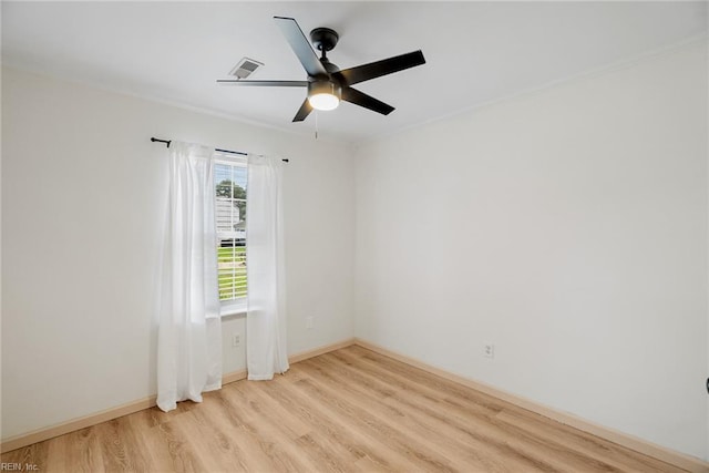 unfurnished room featuring visible vents, ceiling fan, light wood-style flooring, and baseboards