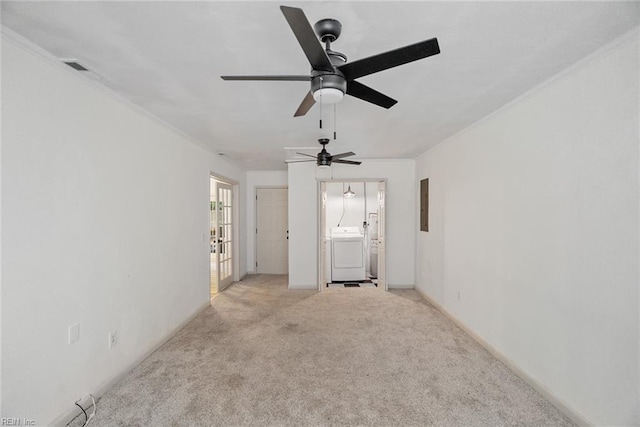 interior space featuring washer / dryer, a ceiling fan, electric panel, and light carpet