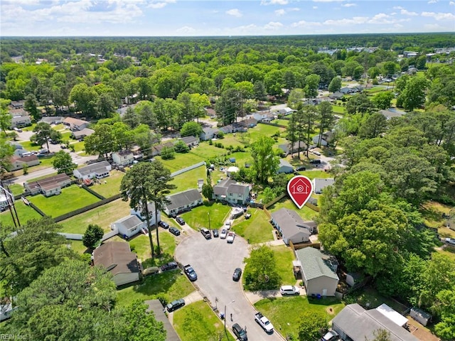 drone / aerial view with a residential view and a forest view