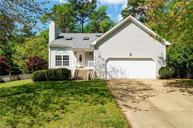 view of front of property with a chimney, fence, a garage, a front lawn, and concrete driveway