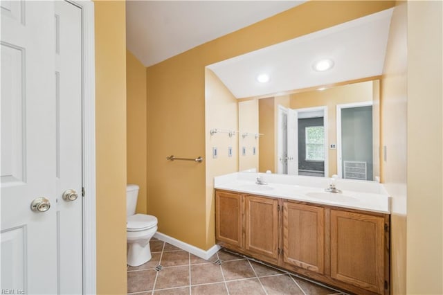 full bathroom with tile patterned floors, toilet, baseboards, and a sink