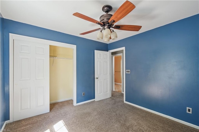 unfurnished bedroom with a closet, baseboards, a ceiling fan, and carpet floors