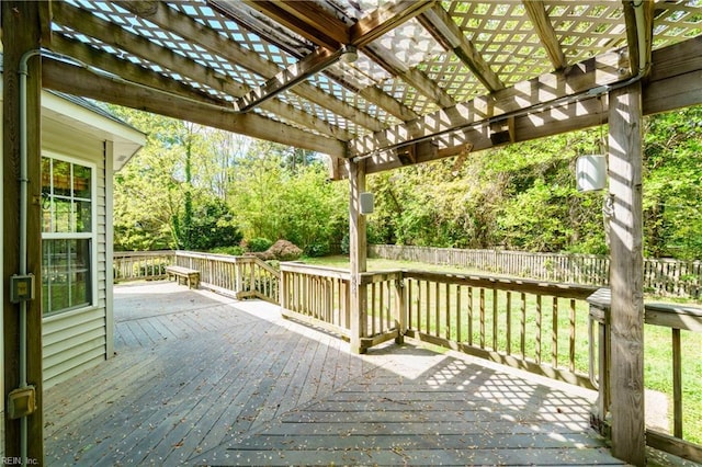 wooden terrace with fence, a yard, and a pergola