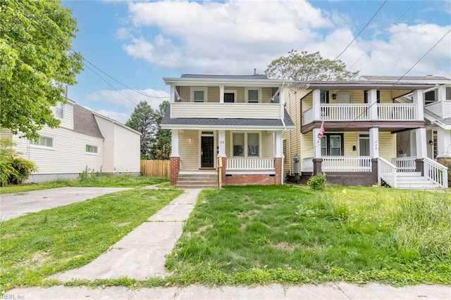 view of front of house with a porch and a front lawn