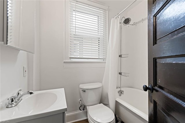 full bathroom featuring shower / bath combo, vanity, toilet, and plenty of natural light