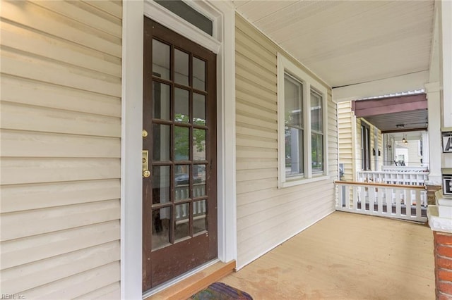 doorway to property featuring a porch