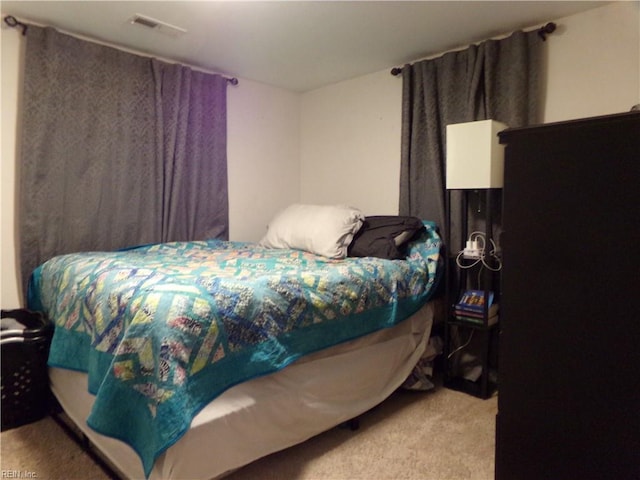 carpeted bedroom with visible vents