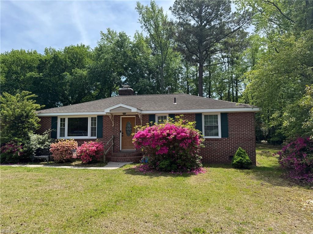 1761 Wolfsnare Rd, Virginia Beach, VA 23454 - ranch-style home with a chimney, brick siding, entry steps, and a front lawn