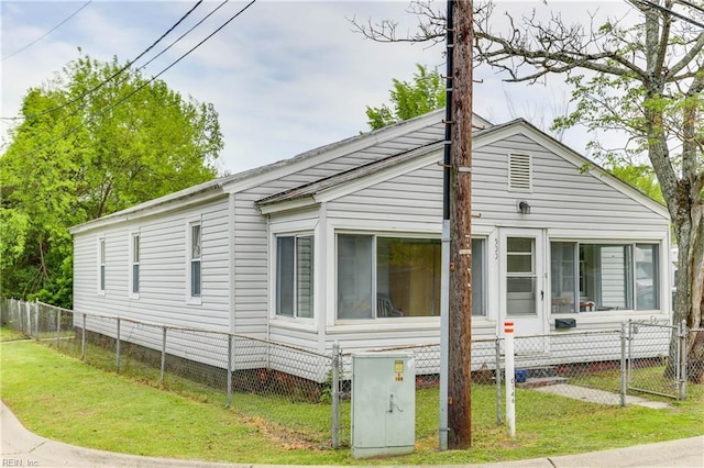 500 Factory St, Suffolk, VA 23434 - view of property exterior featuring a yard and a fenced front yard