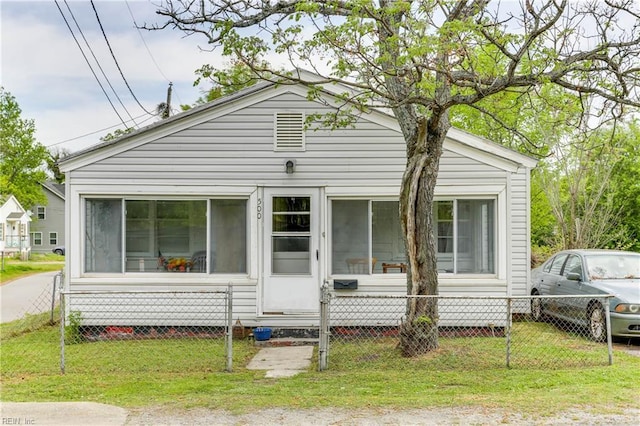 500 Factory St, Suffolk, VA 23434 - bungalow with a sunroom, a front lawn, and fence private yard
