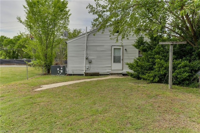 500 Factory St, Suffolk, VA 23434 - back of property with fence, central AC unit, and a lawn