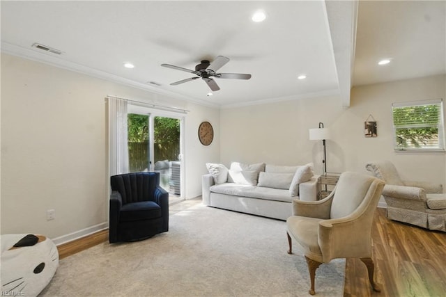 living area with wood finished floors, visible vents, ceiling fan, and recessed lighting