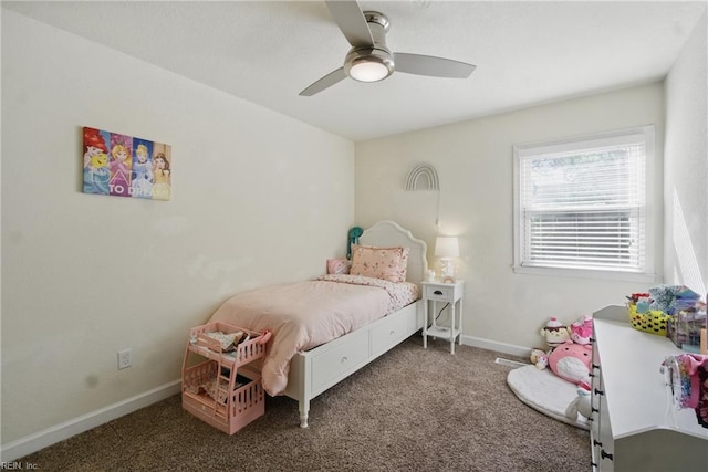 carpeted bedroom with ceiling fan and baseboards