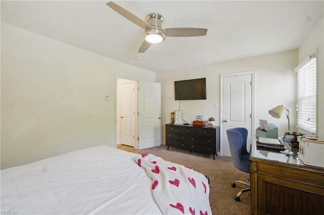 carpeted bedroom featuring a ceiling fan