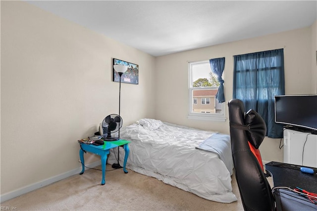 carpeted bedroom with baseboards