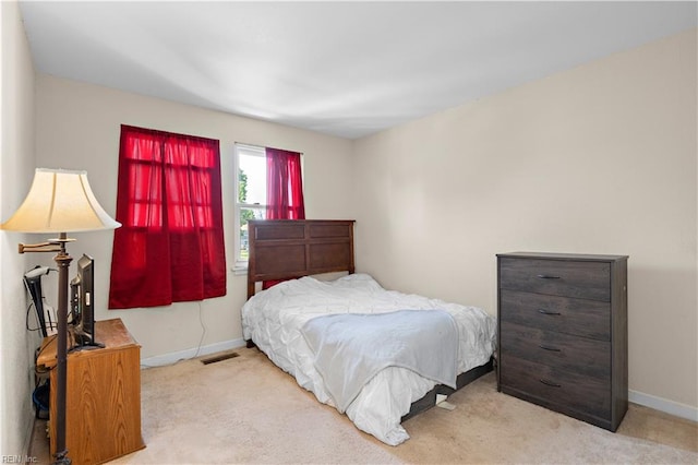 bedroom featuring carpet, visible vents, and baseboards