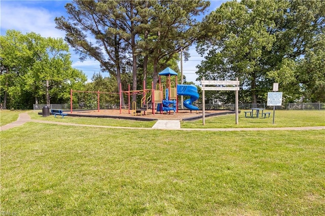 communal playground with fence and a yard