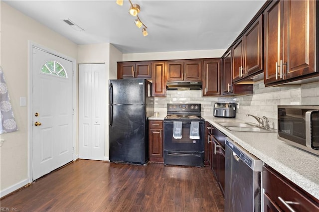 kitchen featuring a sink, visible vents, light countertops, under cabinet range hood, and black appliances