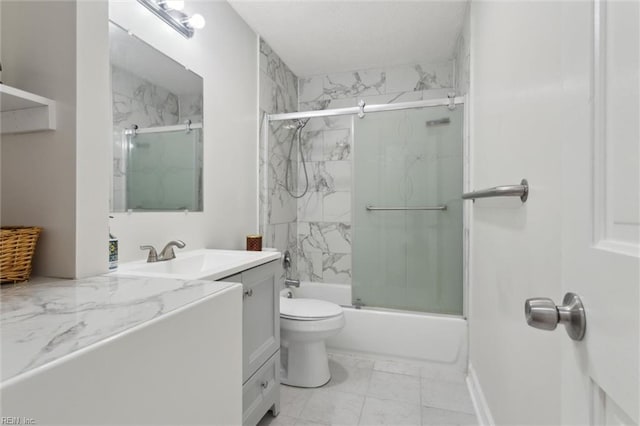 bathroom with toilet, enclosed tub / shower combo, vanity, and marble finish floor