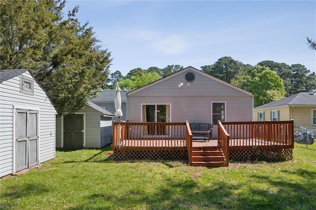 rear view of house featuring an outbuilding, a storage shed, a deck, and a yard