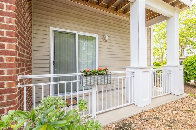 view of exterior entry featuring a porch