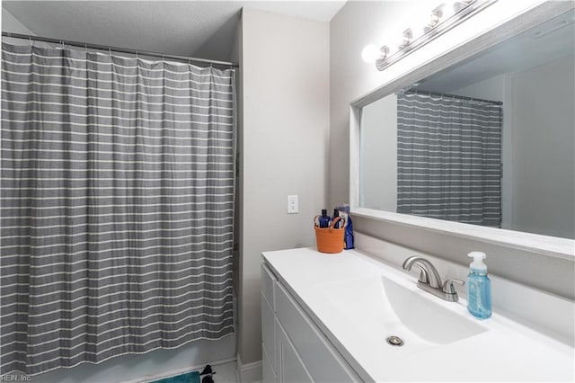 full bath featuring vanity and a shower with shower curtain