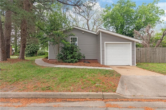 ranch-style house with fence, driveway, a front lawn, and a garage