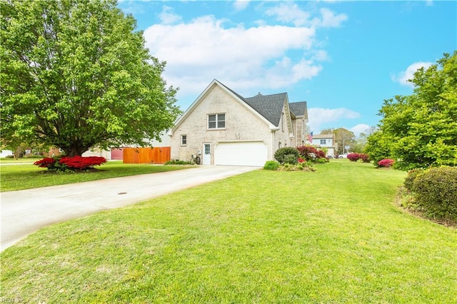 view of front of property with fence, driveway, and a front yard