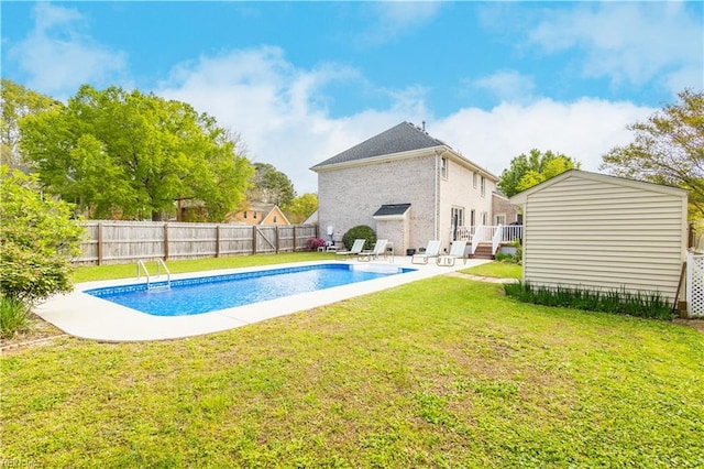 view of swimming pool with a fenced backyard, a fenced in pool, a yard, and a wooden deck