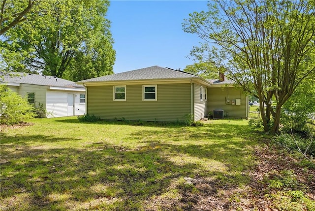 1619 Linden Ave, Chesapeake, VA 23325 - rear view of house featuring central AC and a lawn