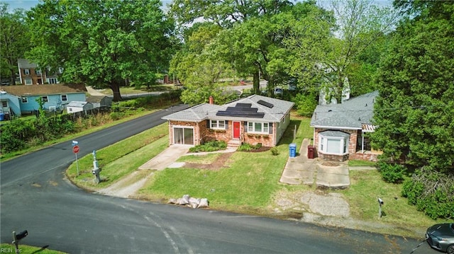 1619 Linden Ave, Chesapeake, VA 23325 - bungalow-style home with brick siding, a front lawn, solar panels, and driveway