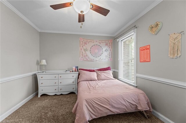 bedroom featuring baseboards, ornamental molding, and carpet