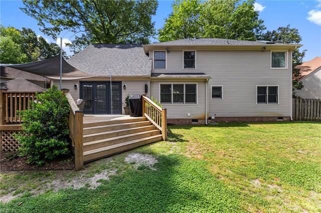 back of property featuring a wooden deck, a yard, and crawl space