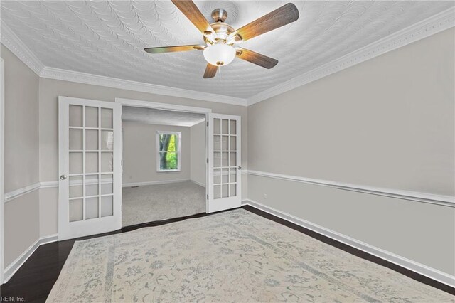 empty room with french doors, baseboards, dark wood-type flooring, and ceiling fan